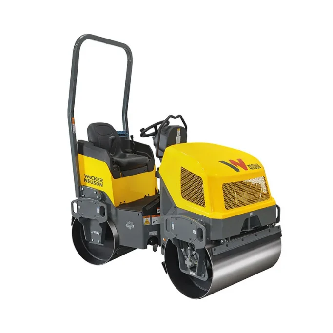 Rodillo compactador amarillos y grises con asientos y ruedas delanteras grandes.